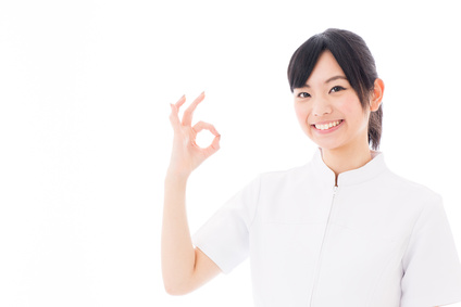 attractive asian nurse on white background